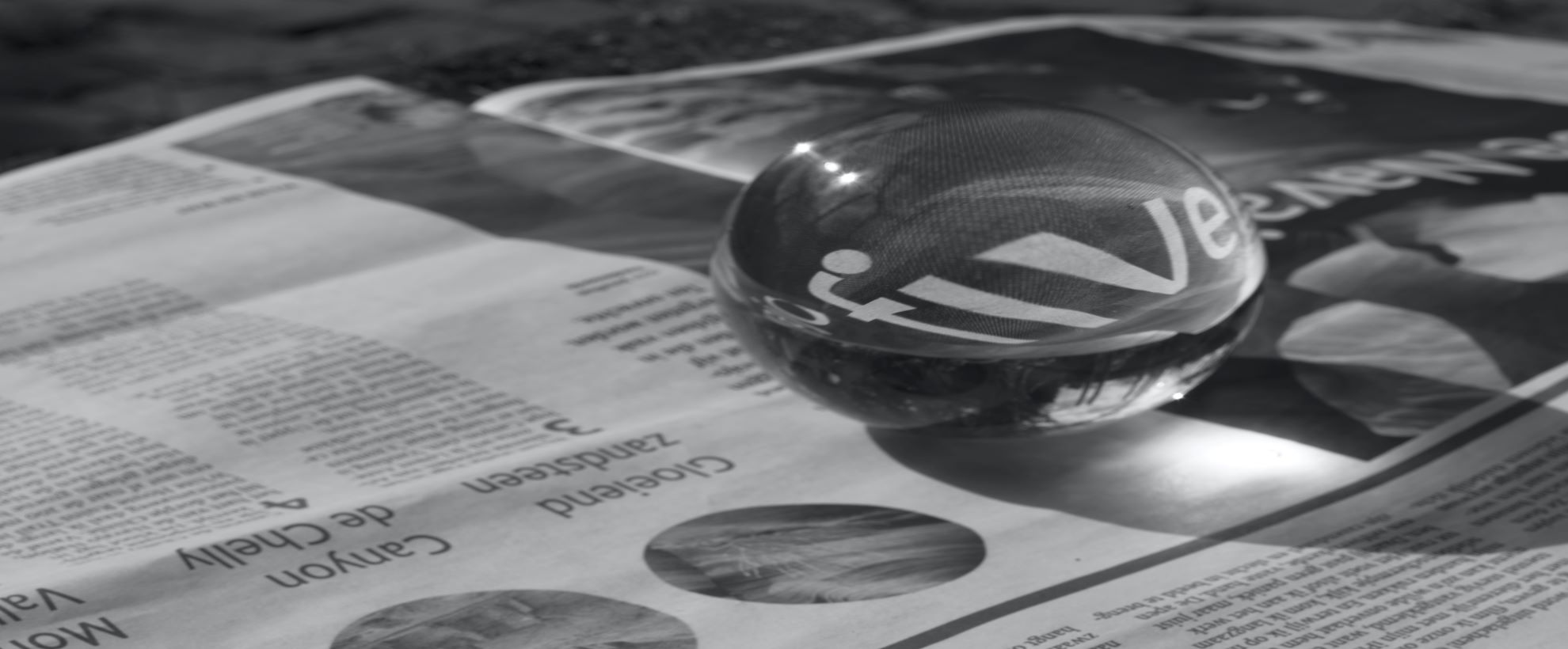 newspaper with crystal ball